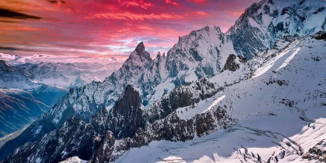 Snow-covered mountains above Courmayeur ski resort in the Italian Alps.