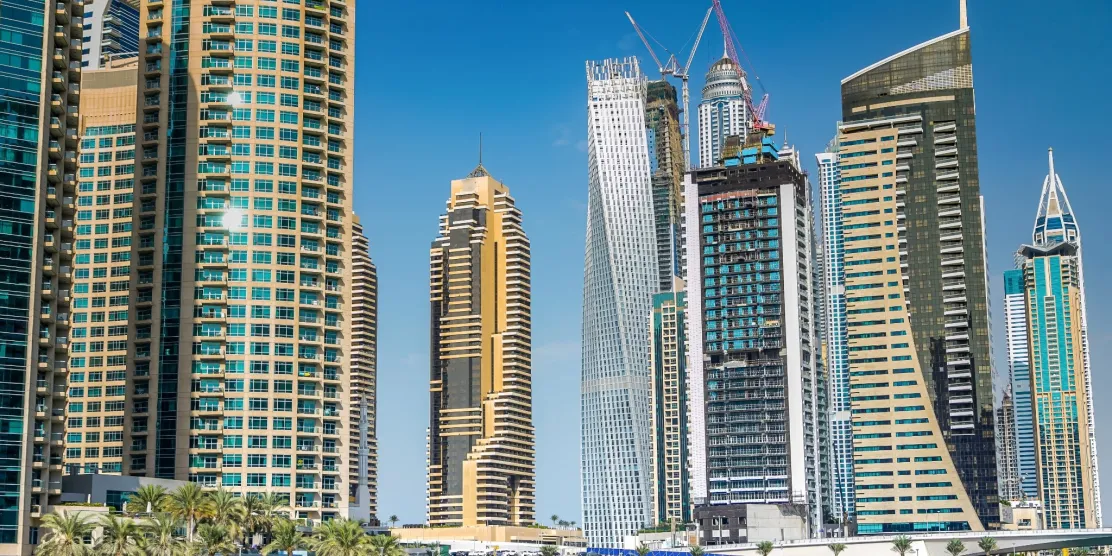 Dubai skyline and modern skyscrapers under a clear blue sky in December