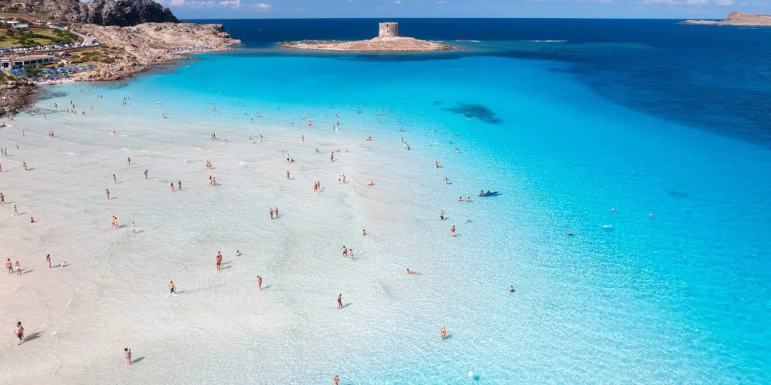 Turquoise waters of La Pelosa Beach in Sardinia, Italy