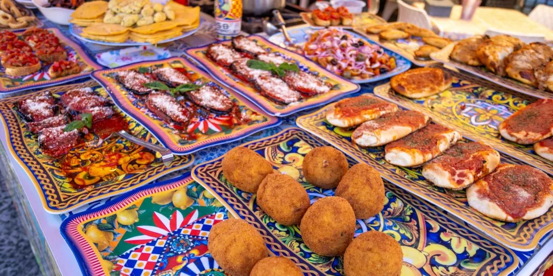 Traditional Sicilian street food displayed at a market in Sicily
