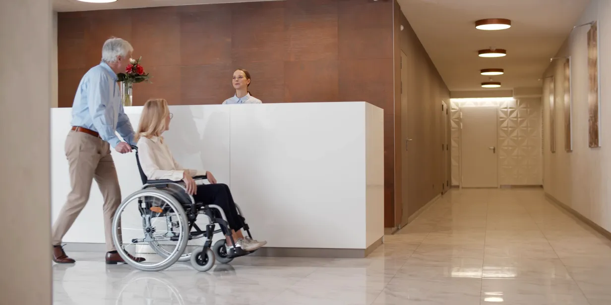 Hotel reception with a person  with disability